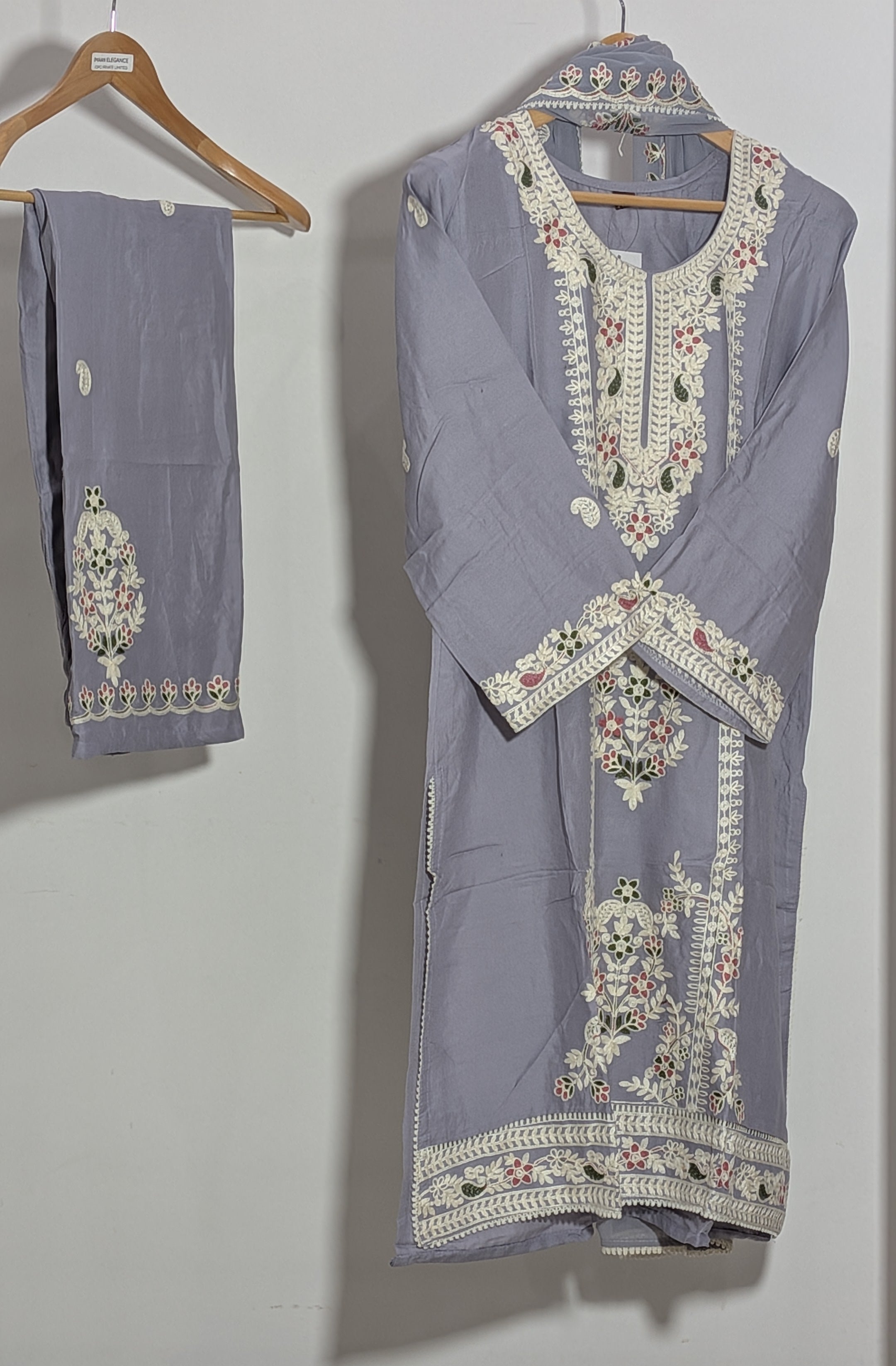 Light blue embroidered traditional outfit with matching dupatta on a white background